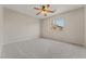 Bright bedroom with a ceiling fan and large window, creating a comfortable and airy space at 1287 Dove Tree Ct, Henderson, NV 89014