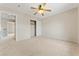 Carpeted bedroom featuring a ceiling fan and closet, offering a comfortable and functional space at 1287 Dove Tree Ct, Henderson, NV 89014