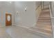 Bright entryway with carpeted staircase and decorative sconces at 1287 Dove Tree Ct, Henderson, NV 89014
