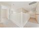 Upstairs hallway featuring white railings, carpet, and natural light at 1287 Dove Tree Ct, Henderson, NV 89014