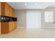 Bright kitchen with tile floors and granite counters offers lots of cabinet space at 1287 Dove Tree Ct, Henderson, NV 89014