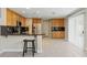Spacious kitchen with island, stainless appliances, and breakfast bar seating at 1287 Dove Tree Ct, Henderson, NV 89014