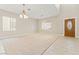 Spacious living area with neutral paint, ample natural light and tile and carpet flooring at 1287 Dove Tree Ct, Henderson, NV 89014
