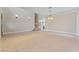 Open living room floor plan with staircase and decorative wall sconces at 1287 Dove Tree Ct, Henderson, NV 89014
