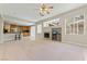 Open living space with fireplace, tile flooring, and a seamless transition to the kitchen at 1287 Dove Tree Ct, Henderson, NV 89014