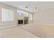Bright living room features a fireplace and large windows that provide natural light at 1287 Dove Tree Ct, Henderson, NV 89014