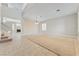 Bright and spacious living room offering abundant natural light and staircase at 1287 Dove Tree Ct, Henderson, NV 89014