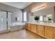 Bright bathroom features a shower, soaking tub, and double sink vanity at 1454 Erskine Ave, Las Vegas, NV 89123