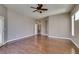 Bedroom with hardwood floors, base molding, and natural light from a window at 1454 Erskine Ave, Las Vegas, NV 89123