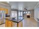 Open-concept kitchen featuring granite countertops and stainless steel appliances at 1454 Erskine Ave, Las Vegas, NV 89123
