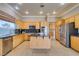 Bright kitchen featuring an island, granite countertops, and stainless steel appliances at 1454 Erskine Ave, Las Vegas, NV 89123