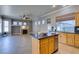 Spacious kitchen with granite countertops, wooden cabinets, and an island at 1454 Erskine Ave, Las Vegas, NV 89123