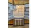 Stainless steel refrigerator in kitchen, surrounded by wood cabinets at 1454 Erskine Ave, Las Vegas, NV 89123