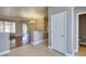 View of living room with hardwood floors, chandelier, and access to the bathroom at 1454 Erskine Ave, Las Vegas, NV 89123