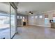 Bright living room with modern fireplace, backyard access, and tile flooring at 1454 Erskine Ave, Las Vegas, NV 89123