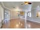Spacious living room with hardwood flooring, neutral walls, and bright lighting at 1454 Erskine Ave, Las Vegas, NV 89123