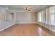 Bright living room boasts hardwood floors, large windows, and neutral paint at 1454 Erskine Ave, Las Vegas, NV 89123