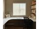 Bright office area with a large window, custom desk and built in shelves at 1454 Erskine Ave, Las Vegas, NV 89123