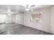 Bedroom featuring a ceiling fan, a large window and a full mirrored wardrobe at 1574 Teardrop St, Las Vegas, NV 89142