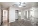 Open-concept bedroom featuring gray wood floors and a full mirrored wardrobe at 1574 Teardrop St, Las Vegas, NV 89142