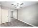 Bedroom with wood-look flooring and mirrored closet at 1574 Teardrop St, Las Vegas, NV 89142