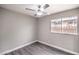 Bedroom featuring wood-look flooring, neutral paint, and ceiling fan at 1574 Teardrop St, Las Vegas, NV 89142
