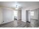Modern bedroom features gray wood floors and a closet that leads to a bathroom at 1574 Teardrop St, Las Vegas, NV 89142
