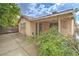 Back of home with covered patio and concrete patio at 1574 Teardrop St, Las Vegas, NV 89142