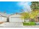 Charming single-story home featuring a two-car garage, well-maintained lawn and mature landscaping at 1574 Teardrop St, Las Vegas, NV 89142
