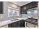 Modern kitchen featuring stainless appliances, updated lighting and subway tile at 1574 Teardrop St, Las Vegas, NV 89142