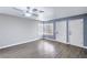 Bright living room with neutral paint, updated ceiling fan and modern gray floors at 1574 Teardrop St, Las Vegas, NV 89142