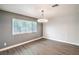 Bright and airy living room featuring neutral tones, large window, and contemporary flooring at 1574 Teardrop St, Las Vegas, NV 89142