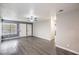 Bright living room with neutral paint, updated ceiling fan and modern gray floors at 1574 Teardrop St, Las Vegas, NV 89142