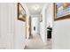 Hallway with white walls and carpet, providing access to rooms with natural light at 1751 E Reno Ave # 206, Las Vegas, NV 89119