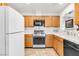 Bright kitchen featuring modern appliances, ample cabinet space, and tile countertops at 1751 E Reno Ave # 206, Las Vegas, NV 89119