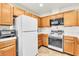 Bright kitchen featuring modern appliances, ample cabinet space, and tile countertops at 1751 E Reno Ave # 206, Las Vegas, NV 89119