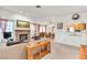 Bright living room with a fireplace, view of the dining area, and large windows at 1751 E Reno Ave # 206, Las Vegas, NV 89119