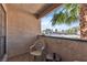 Relaxing outdoor patio with tile flooring, seating, and a view of the surrounding neighborhood at 1751 E Reno Ave # 206, Las Vegas, NV 89119