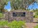Stone entrance to Hillpointe Park community with lush green landscape and clear blue skies at 1851 Hillpointe Rd # 2124, Henderson, NV 89074