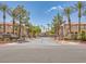 Beautiful community entrance with lush landscaping and well-maintained buildings at 1851 Hillpointe Rd # 2124, Henderson, NV 89074