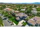 Gorgeous aerial view of a home with well-maintained landscaping, a spacious driveway, and a lush green lawn at 2325 Prometheus Ct, Henderson, NV 89074