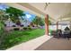 Spacious backyard featuring a covered patio and lush lawn perfect for outdoor enjoyment at 2325 Prometheus Ct, Henderson, NV 89074