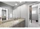 Bathroom featuring granite countertops and a large mirror at 2325 Prometheus Ct, Henderson, NV 89074