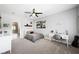 This bedroom has a ceiling fan, a desk, and opens to an ensuite bathroom at 2325 Prometheus Ct, Henderson, NV 89074