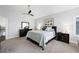 Comfortable primary bedroom with neutral tones, a ceiling fan, and black furniture set at 2325 Prometheus Ct, Henderson, NV 89074
