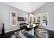 Dining room with decorative light fixture, large windows, and modern decor at 2325 Prometheus Ct, Henderson, NV 89074