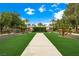 Well-maintained community entrance gate with lush greenery and manicured landscaping at 2325 Prometheus Ct, Henderson, NV 89074