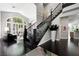 Elegant entryway boasts dark wood floors and staircase, with high ceilings and stylish decor at 2325 Prometheus Ct, Henderson, NV 89074