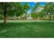 Expansive green space with mature trees, perfect for outdoor activities and relaxation in a serene setting at 2325 Prometheus Ct, Henderson, NV 89074
