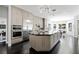Modern kitchen boasting stainless steel appliances, a central island, and seamless integration with the dining space at 2325 Prometheus Ct, Henderson, NV 89074